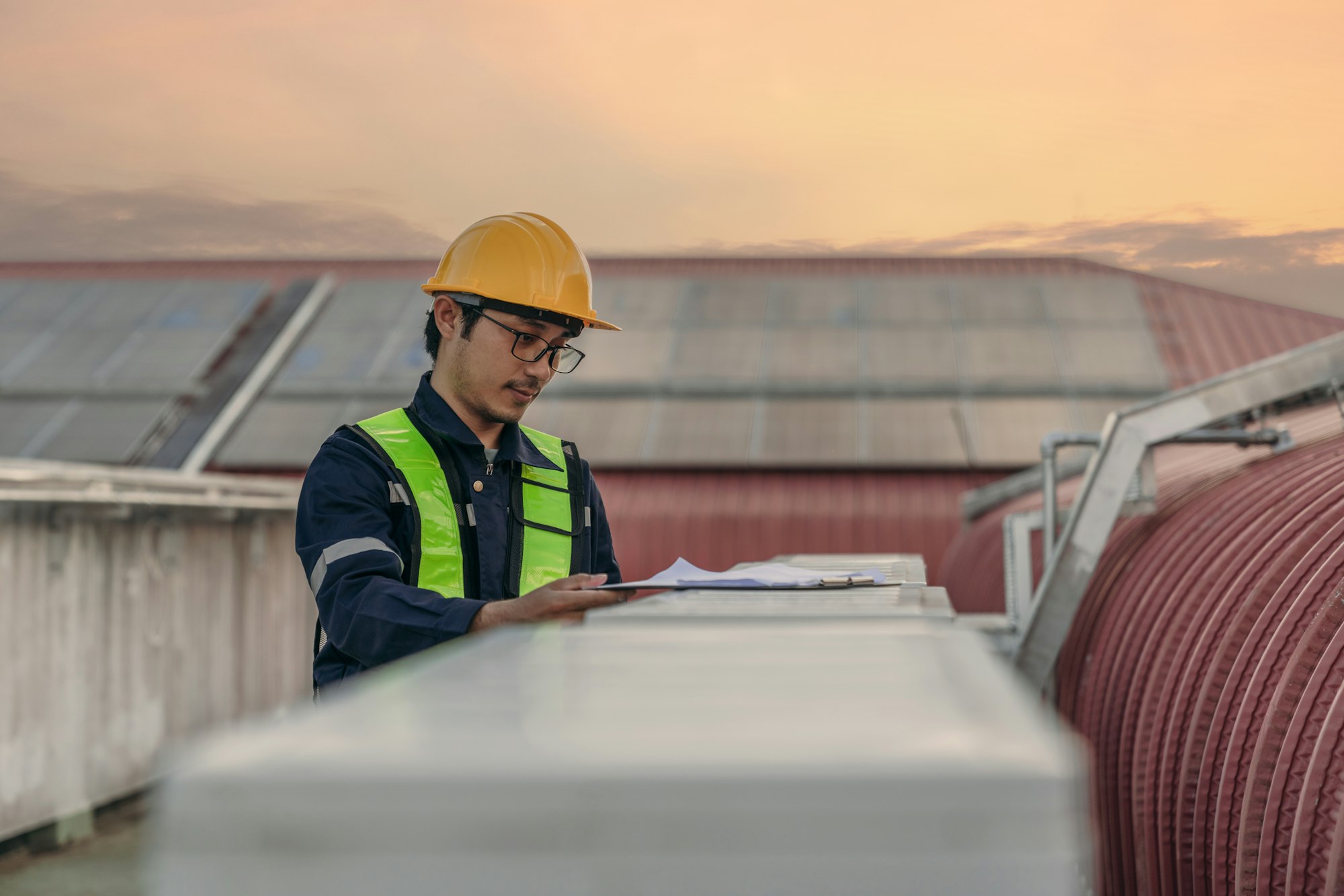 Engineer is checking the air conditioning cooling system of a major building or industrial facility.